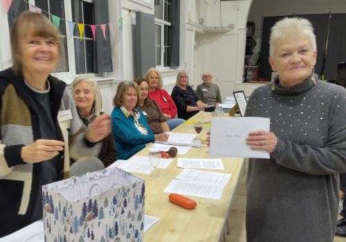 2025 AGM Sheila M receiving her own award and Leila's on her behalf